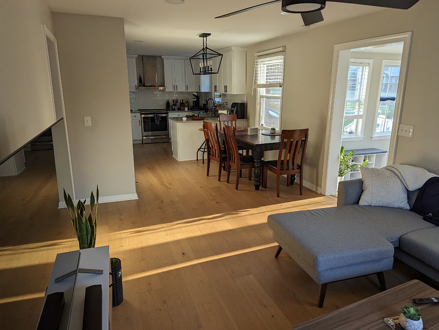 Living room view into dining room/kitchen