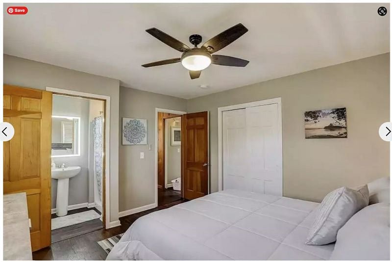 Still the primary bedroom which provides a large dresser and two charging nightstands with lamps and ample closet space