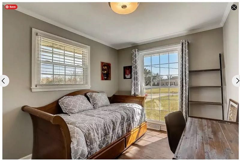 Bedroom 3 has plenty of light, looking at the side and front of the home