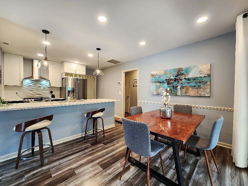 Handmade dining room table with 4 chairs, and dimmer lighting for romantic dinners!