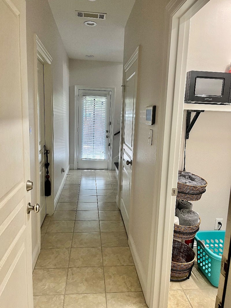 Laundry room across from the bedroom.