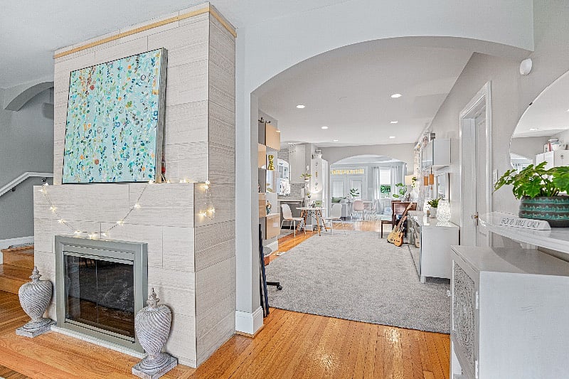 The stairs to the left of the fireplace lead to the Master Suite.