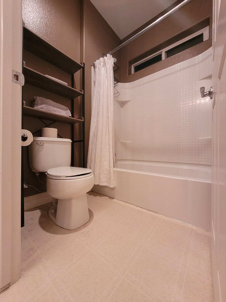Upstairs bedrooms 2 and 3 share this j and j style bathroom. Double sink, large vanity, and a great shower.