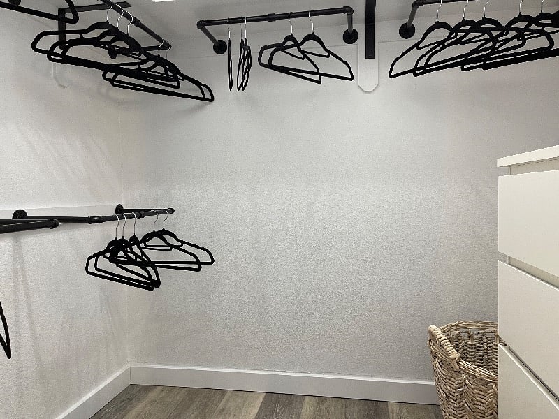 Walk-in closet with dresser