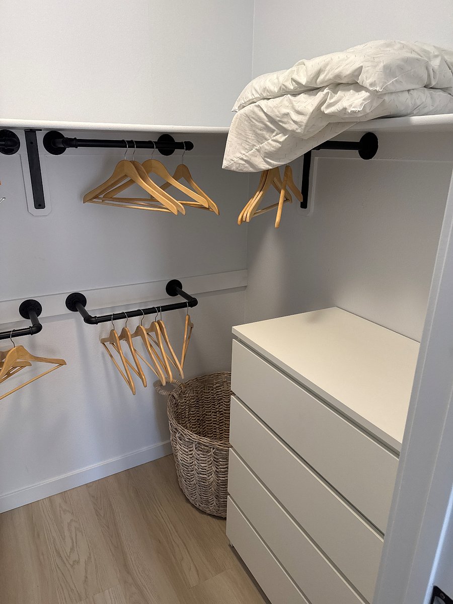 Walk-in closet with dresser