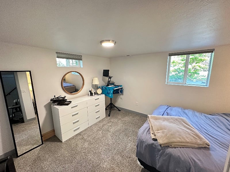 South bedroom with small walk-in closet.