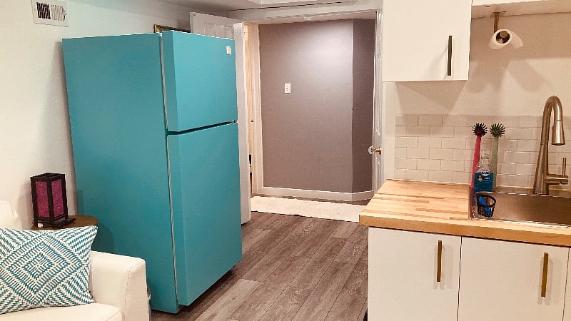 Kitchenette and French doors looking back towards laundry room and landing. 