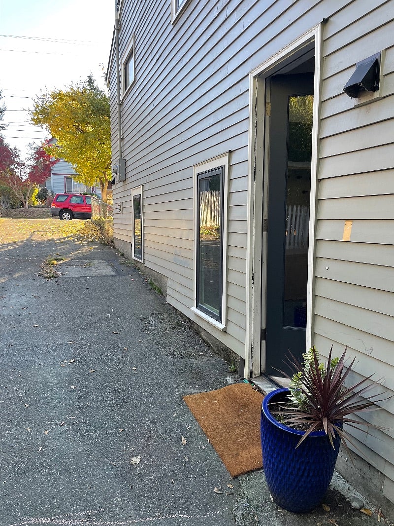 View of driveway (yours if you want it--fits two cars end to end). Host lives upstairs and uses driveway for access to garage.