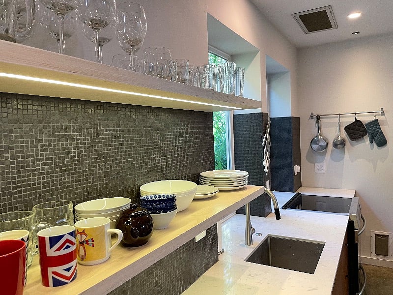 Kitchen is fully stocked with dishes, blender, toaster, pots/pans and plenty of bakeware.