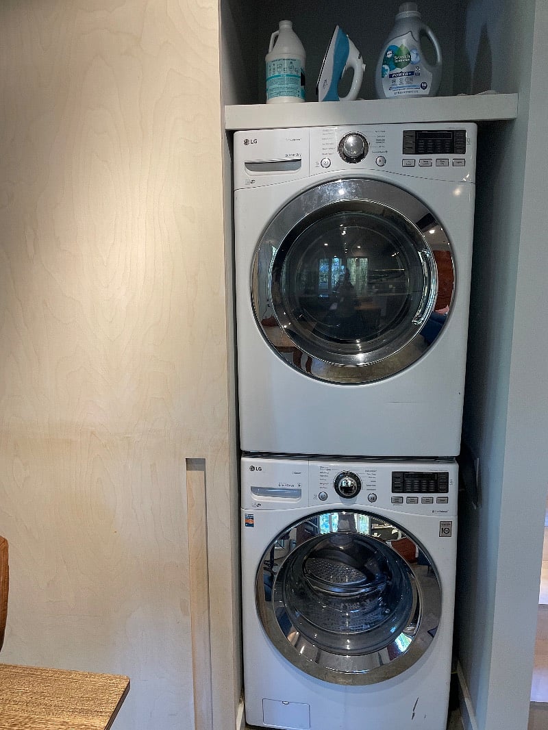 Front loading washer/dryer. Covered by sliding door in main living area.