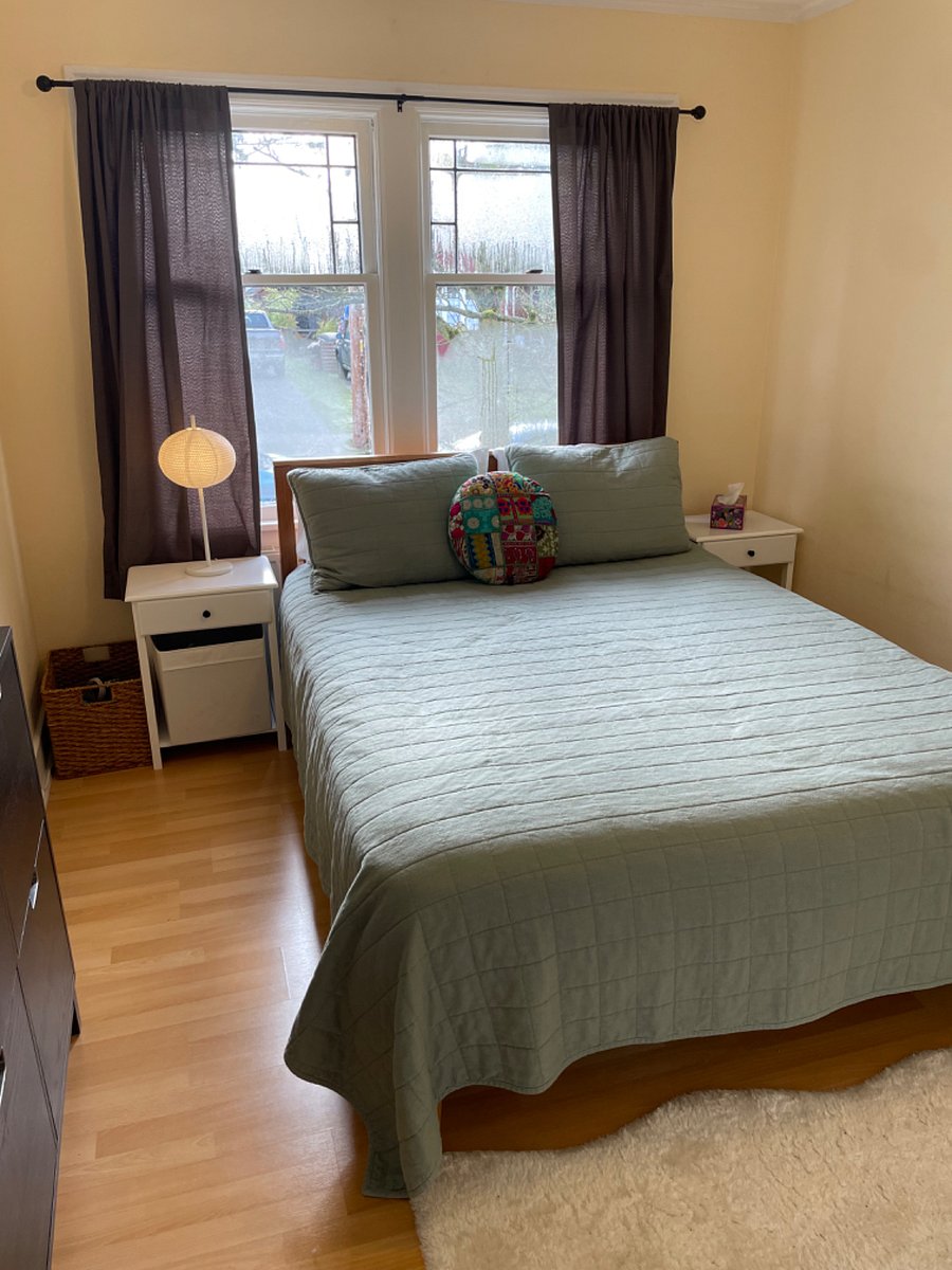 Bedroom one--queen bed with dual end tables