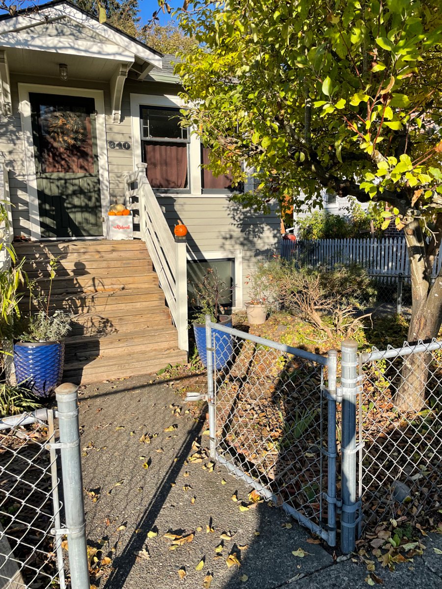 Front of house, gated front yard