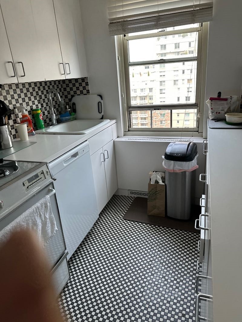 Kitchen with all appliances and dishes