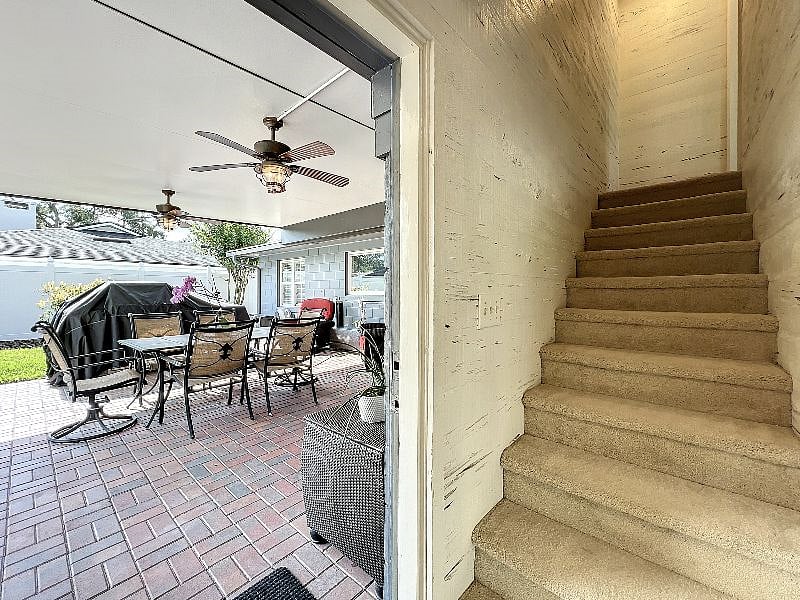 Staircase to 2nd Bedroom/Door to Pool area