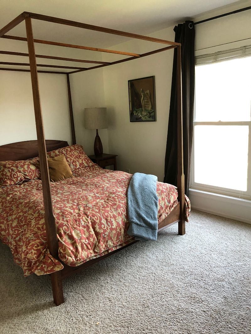Upstairs bedroom with queen bed and walk-in closet