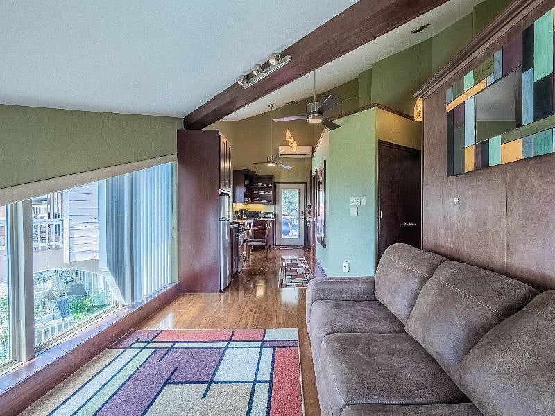 Efficiency with lake views, murphy bed that converts to a couch, kitchenette, laundry room, walkin closet, private access or connects to the primary bedroom hallway