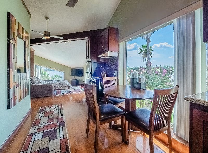 Efficiency with lake views, murphy bed that converts to a couch, kitchenette, laundry room, walkin closet, private access or connects to the primary bedroom hallway