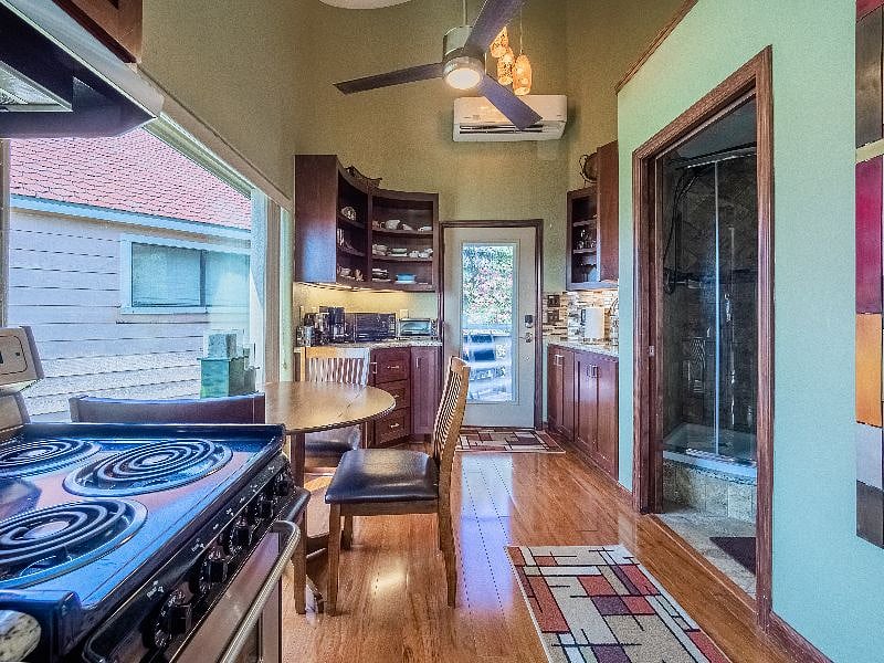 Efficiency with lake views, murphy bed that converts to a couch, kitchenette, laundry room, walkin closet, private access or connects to the primary bedroom hallway