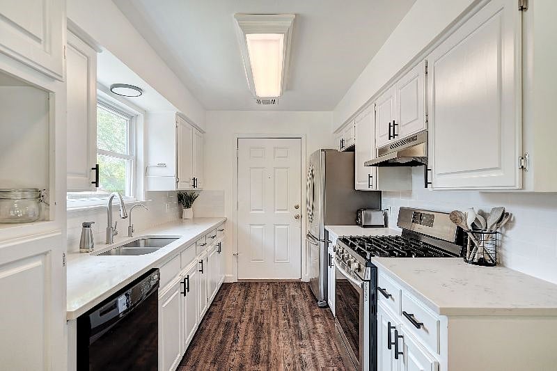 Fully stocked kitchen with dishes, utensils, cookware, and appliances. Additionally, a kitchen aid mixer, toaster, and instant pot are provided to fulfill all your cooking needs.