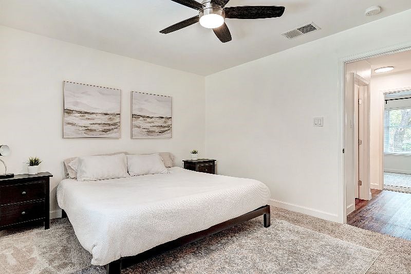 Memory foam king bed, remote controlled ceiling fan, and modern decor