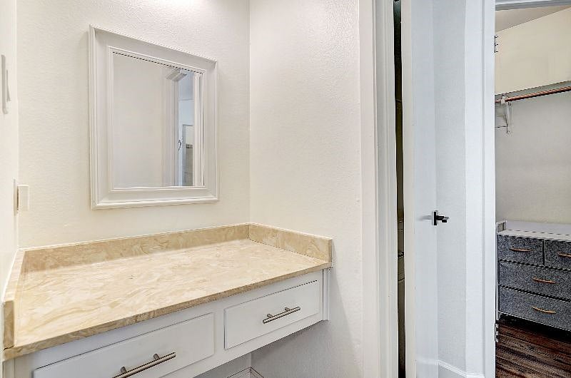 Built in make-up bench or small desk in primary suite