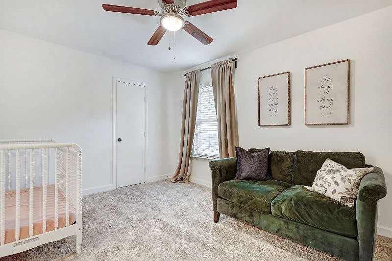 Guest bedroom with full size pull out couch and optional crib