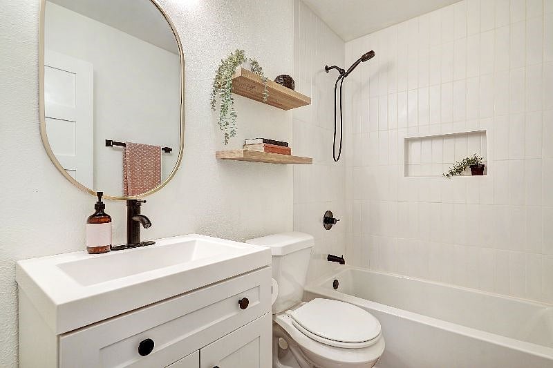 Guest bathroom with tile shower, brand new soaking tub, and modern fixtures