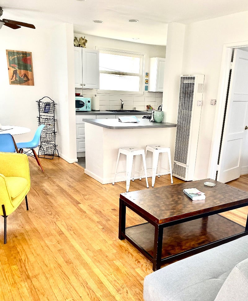 Fully furnished one bedroom apartment with a full size kitchen and private outdoor grill and seating.