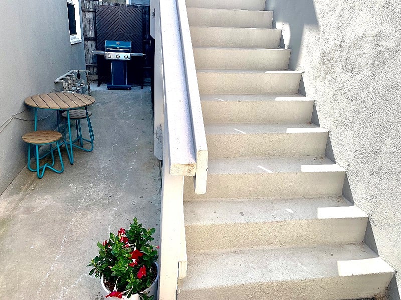 Your own private grilling and seating area off your stairway.
