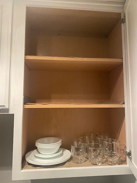 Kitchen has dishes, coffee mugs, and glasses for your use.