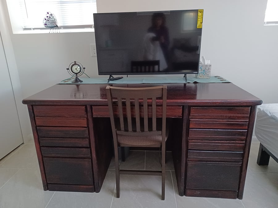 Large solid oak desk with TV on top. I provide internet service thru a hard wired ethernet connection with a multi-hub for your laptop, tablet, or other device