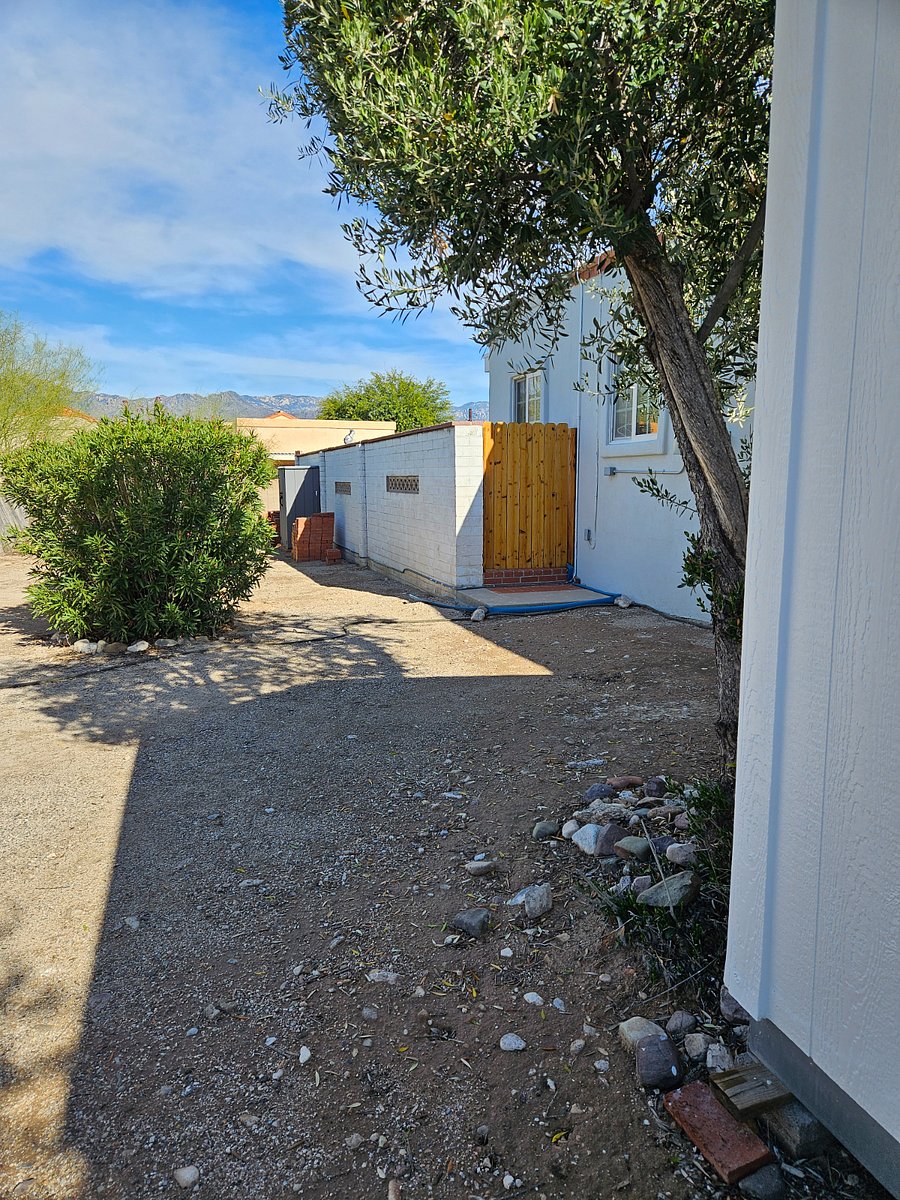 Gate entrance to Studio
Partially shaded parking near gate