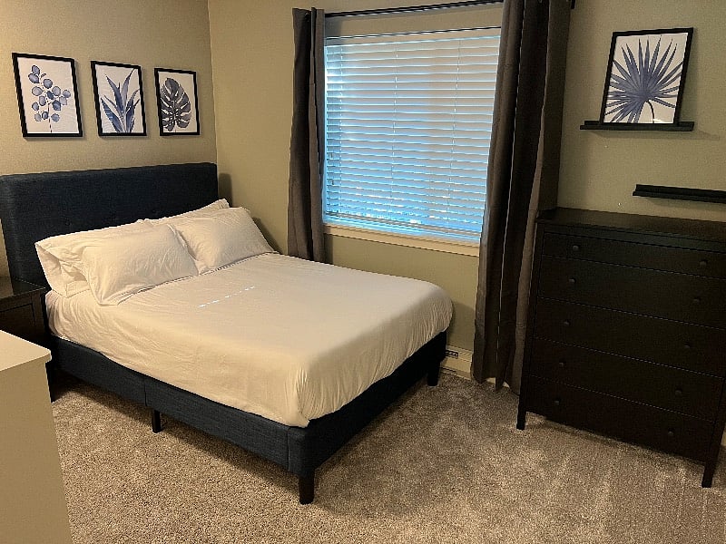 Second Bedroom with full size bed. Comfortable mattress and bedding. Black out curtains and air flilter / white noise machine.