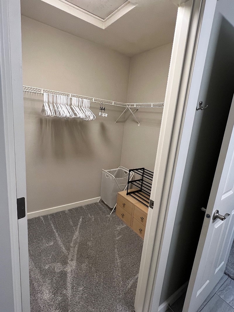 walk in closet in primary bedroom