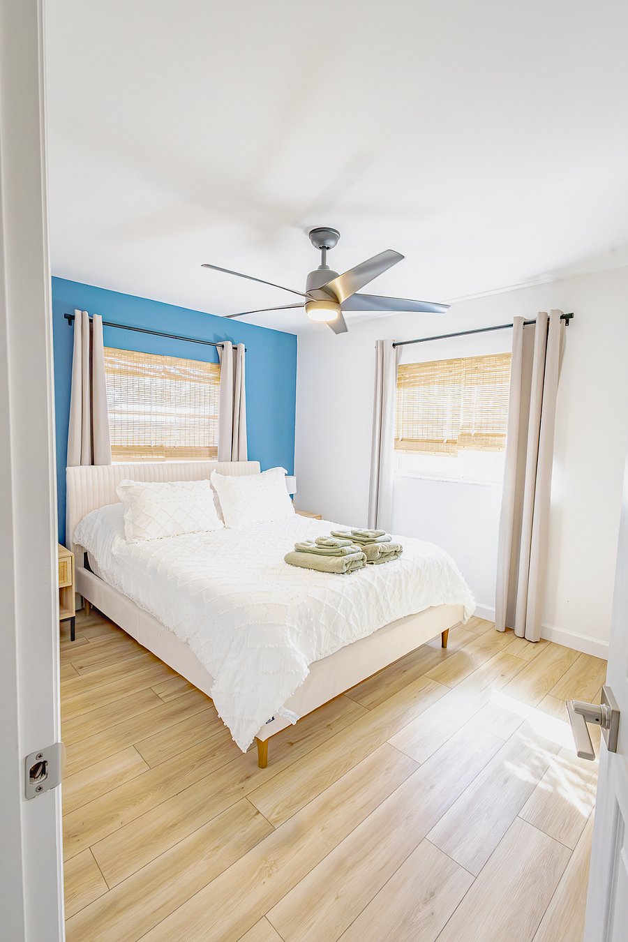 Queen bed with premium linens and fresh towels. Restful coastal decor and natural light for a good night's sleep.