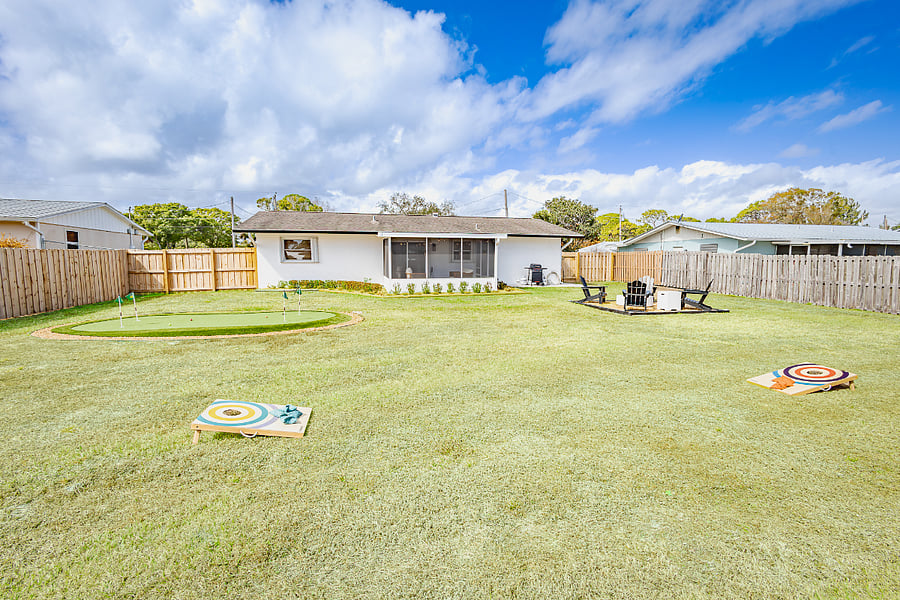 Private fenced backyard with putting green, fire pit, cornhole, and BBQ grill. Pets welcome.