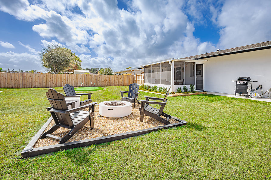 Gather around the gas fire pit with Adirondack seating on cool Florida evenings.