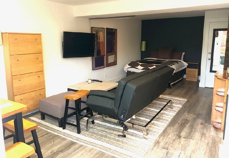 Leather sofa converts into comfortable double bed if you have visitors.
