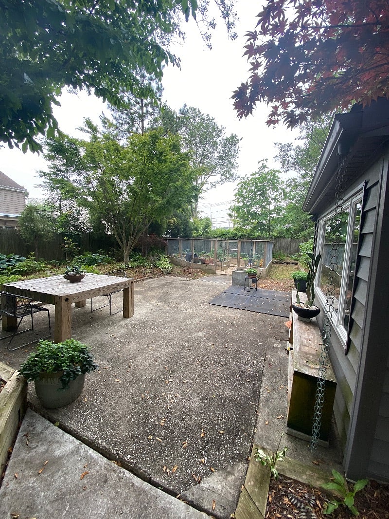 Backyard with vegetable garden & outdoor dining area