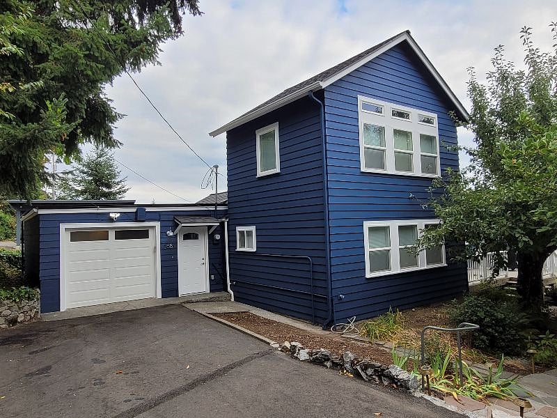Driveway and house with new blue paint job (Oct 2022).