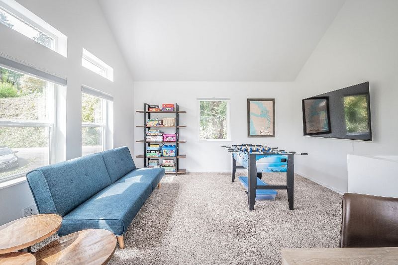 Loft area with 65" Smart TV and games
