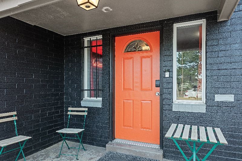 Our dark gray exterior conceals a world of pleasant surprises and comfort waiting to welcome you.