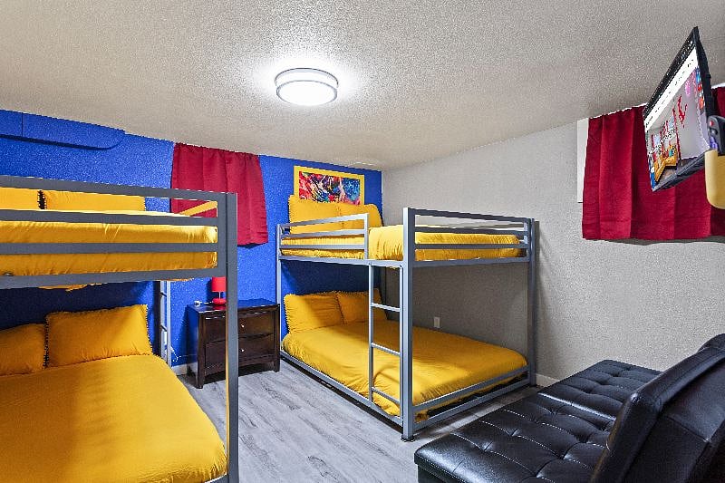 Group Getaway Central  Enjoy a fantastic stay in our room with two double-sized bunk beds and a smart TV for entertainment, perfect for friends or family!