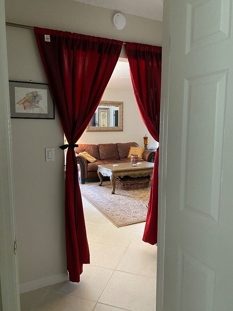 View from Queen bedroom to family room. Privacy curtains can be closet to close off bathroom
