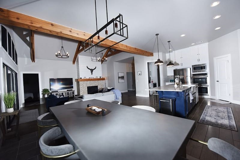 Beautiful Open Floor Plan with Modern Light Fixtures and Finishes in Living Space