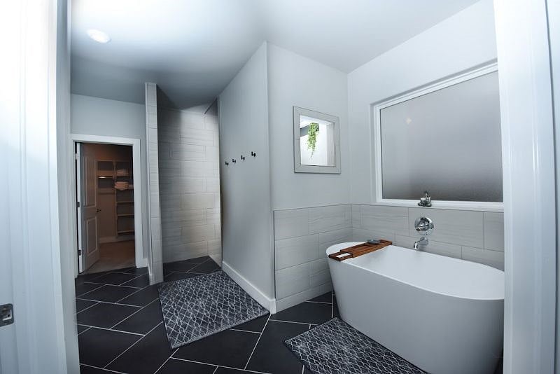 The Modern Soaker Tub and Entry to Walk-In Shower