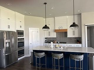 Stainless Appliances, Double Ovens, Walk-In Pantry, and Fully Outfitted with Pots, Pans, Cutlery, Utensils, and Dishware.