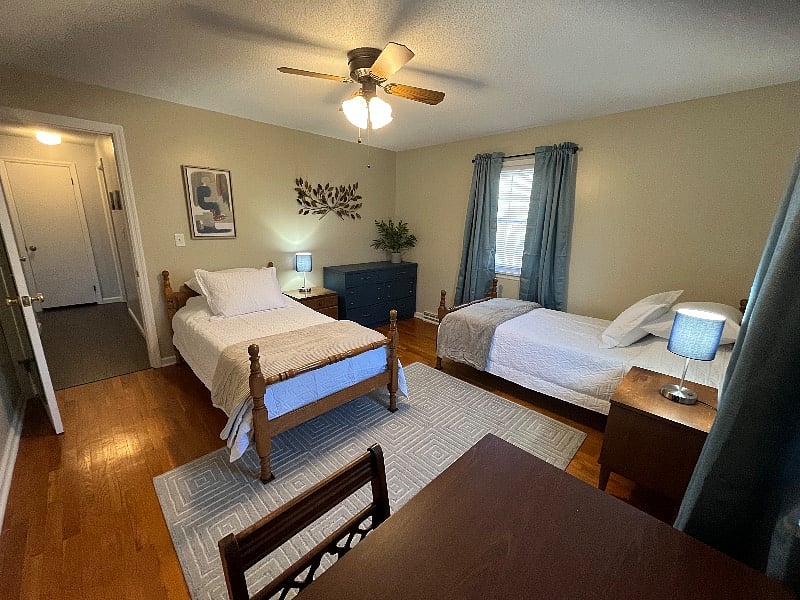Bedroom #3 with two twin beds and a desk. 