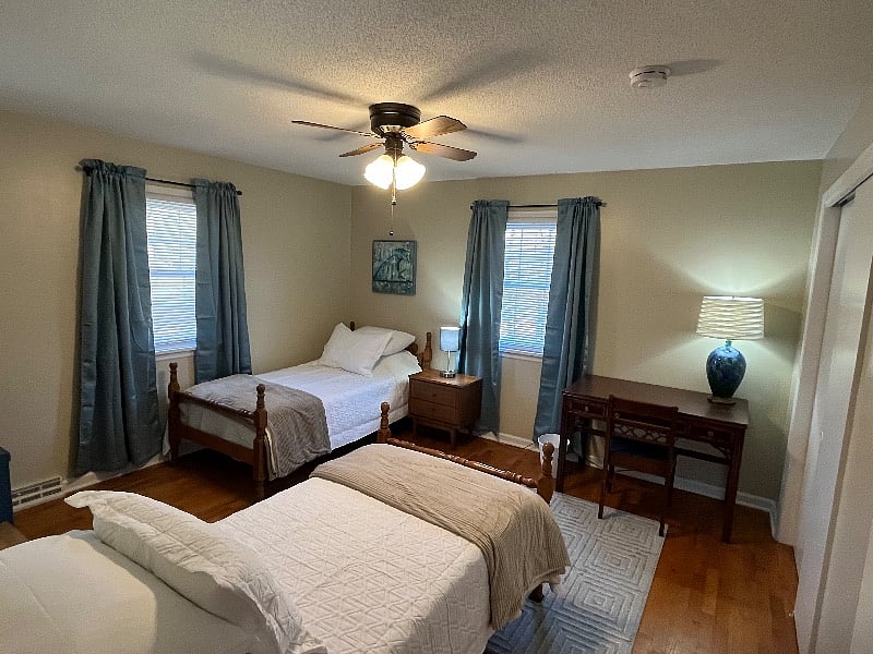 Bedroom #3 with two twin beds and a desk. 