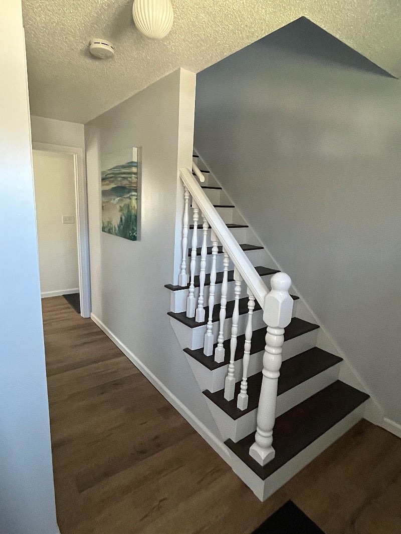 Front door entrance hallway and staircase leading to 2nd floor that includes all three bedrooms and two full bathrooms. 
